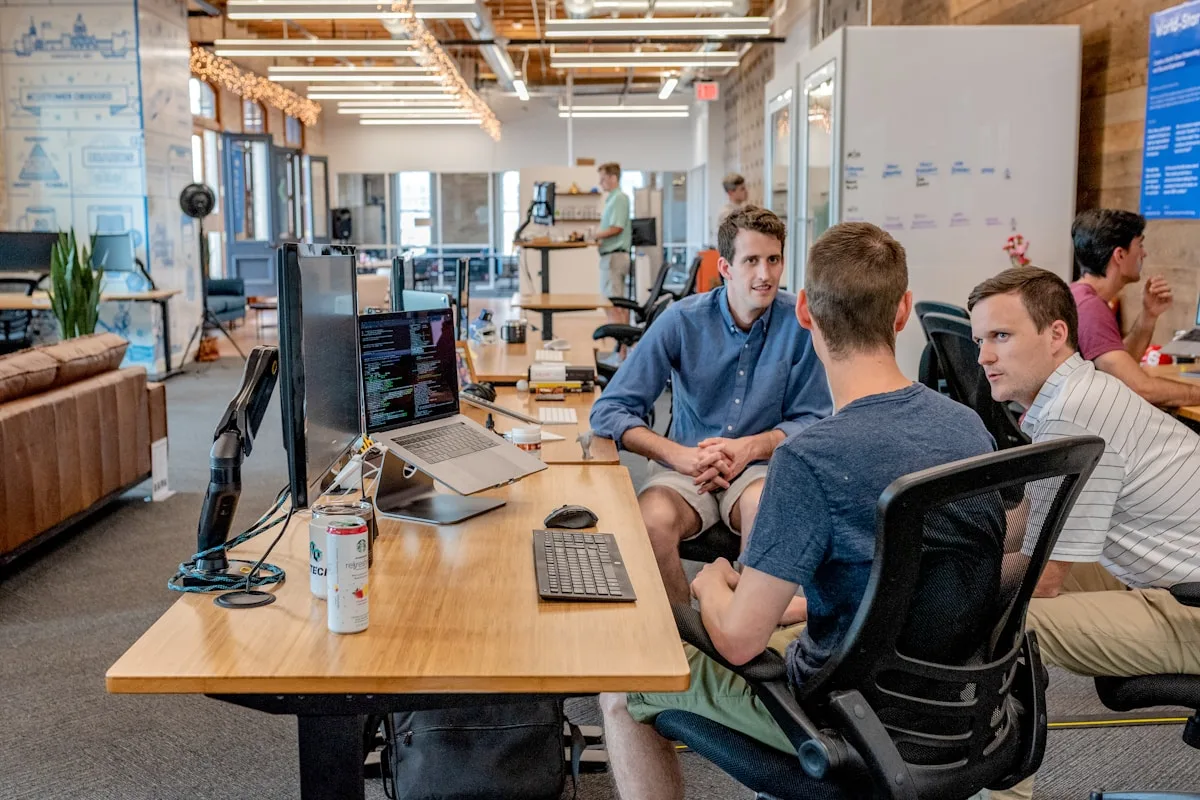 Business team reviewing mobile app pricing and project budget