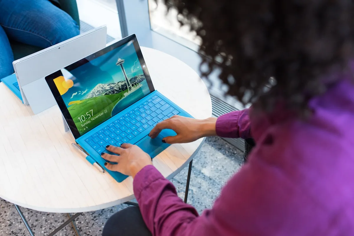 Developer analyzing mobile app cost options on a laptop