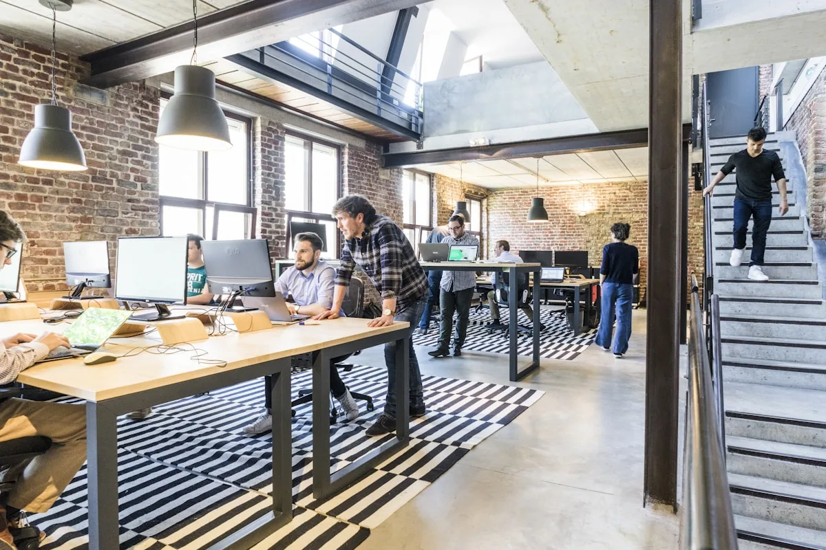 Startup team planning mobile app investment in a bright workspace