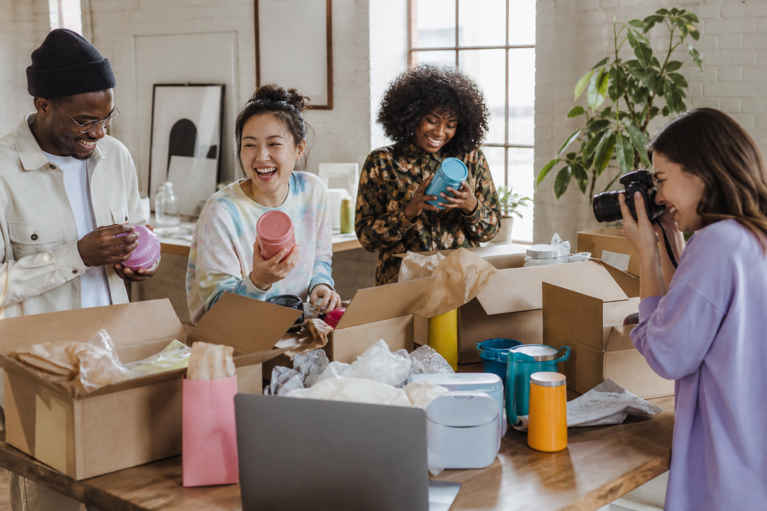 Diverse commerce team preparing products for a digital storefront