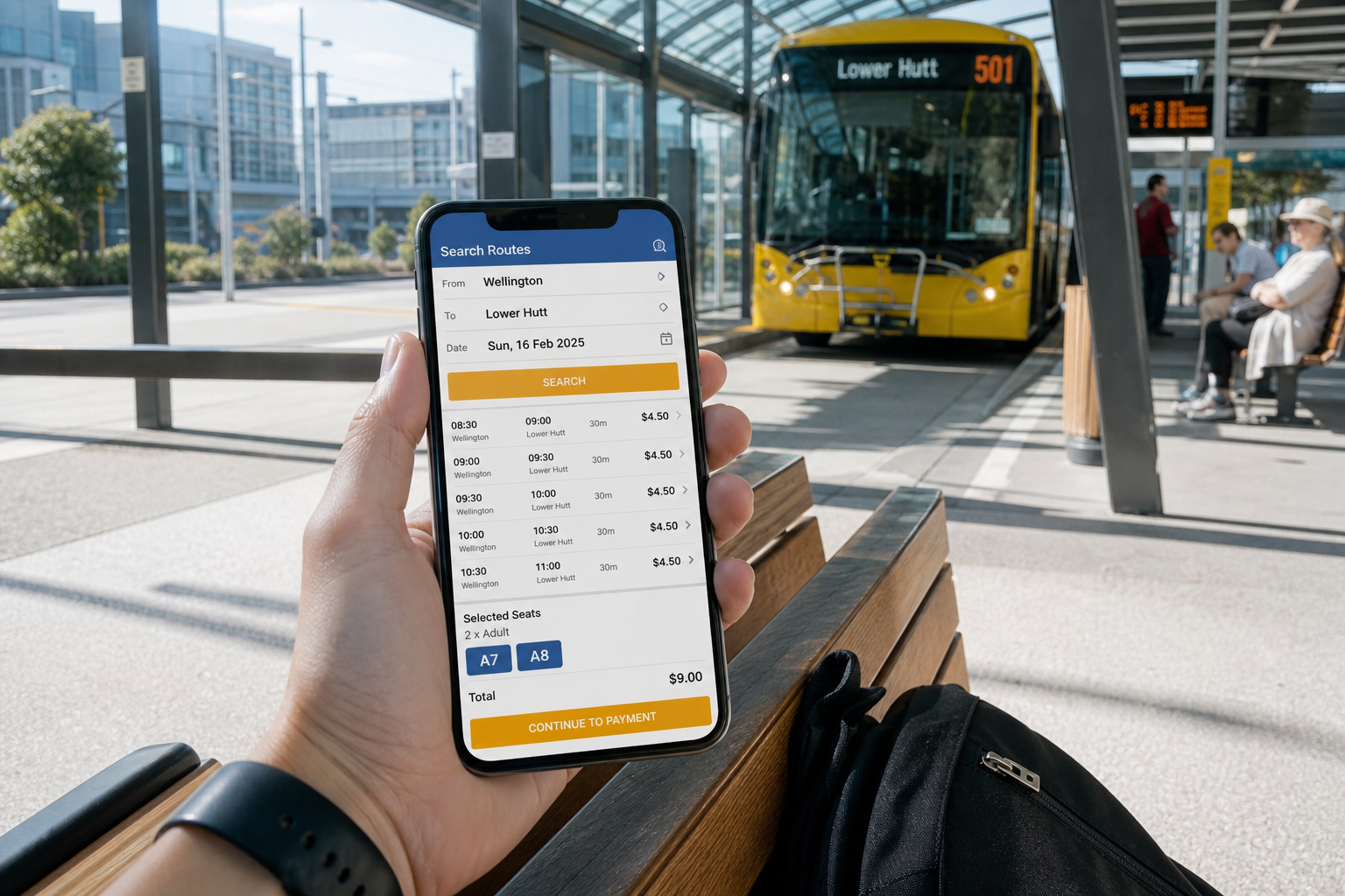 Bright Wellington bus station with a phone showing original route search, schedules and seat selection